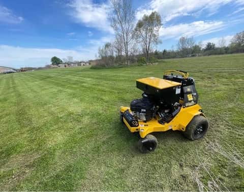 Lawn aeration and overseeding service for a residential yard