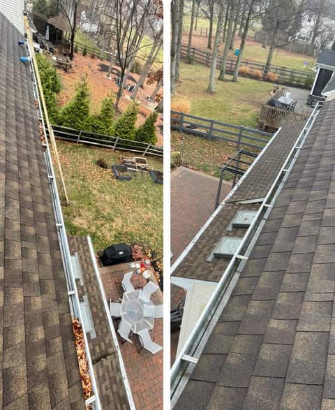 Gutter cleaning service removing debris from residential gutters